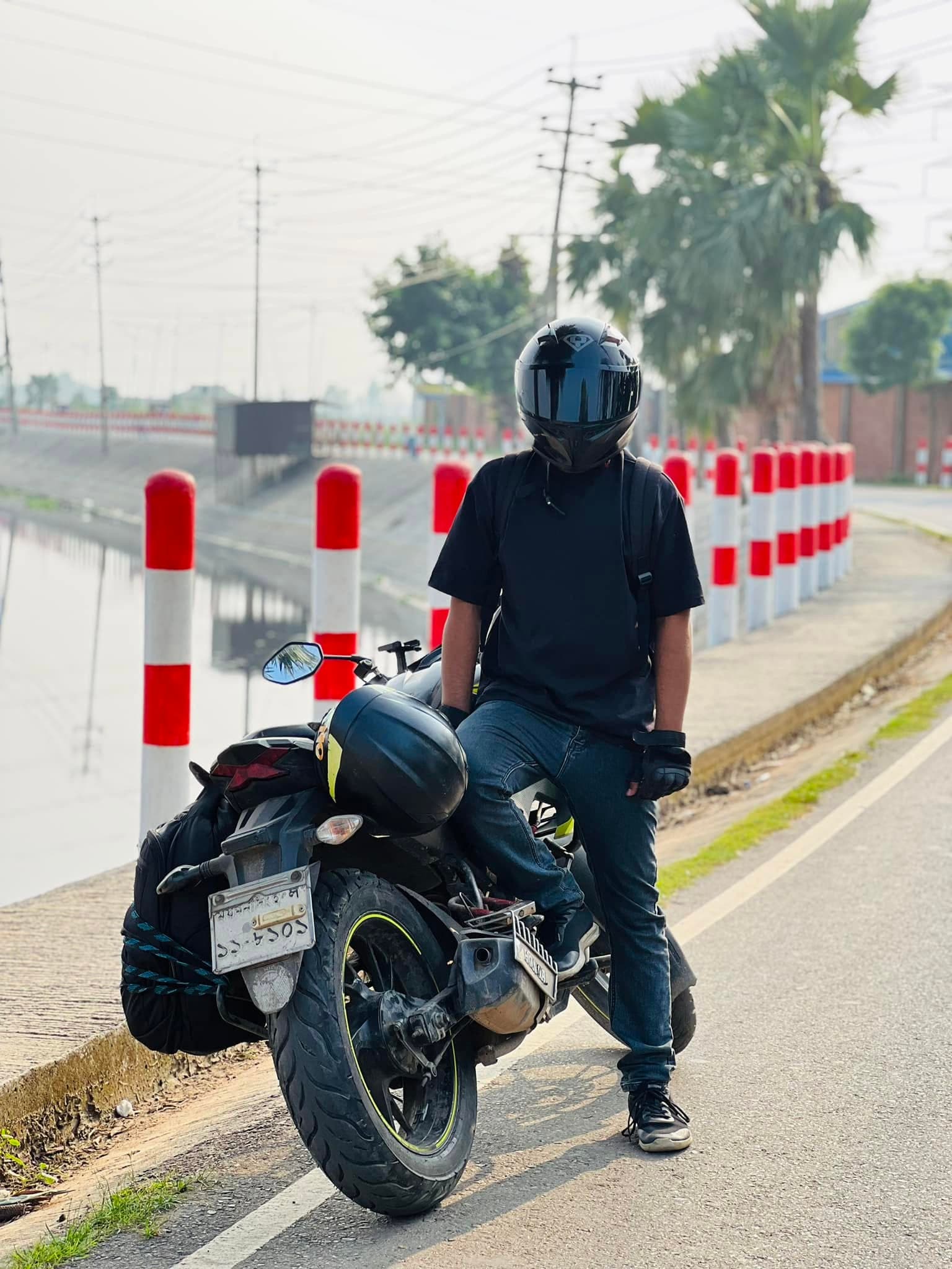 Raihan and his motorcycle on a trip