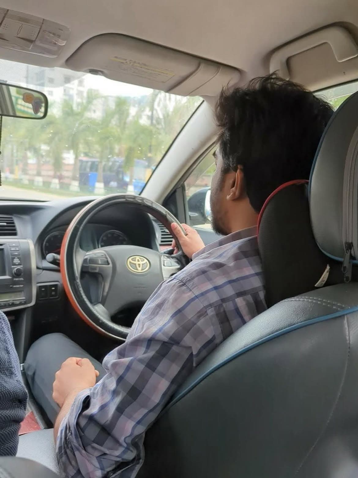 Raihan driving a car